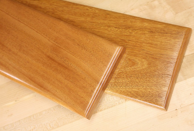 Harder to see in pictures, but the piece on the left has the grain filled with a mahogany colored filler, the piece on the right does not. Both have a lacquer topcoat.