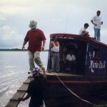 Keith Stephens steps off a water taxi after checking out logs in Peru